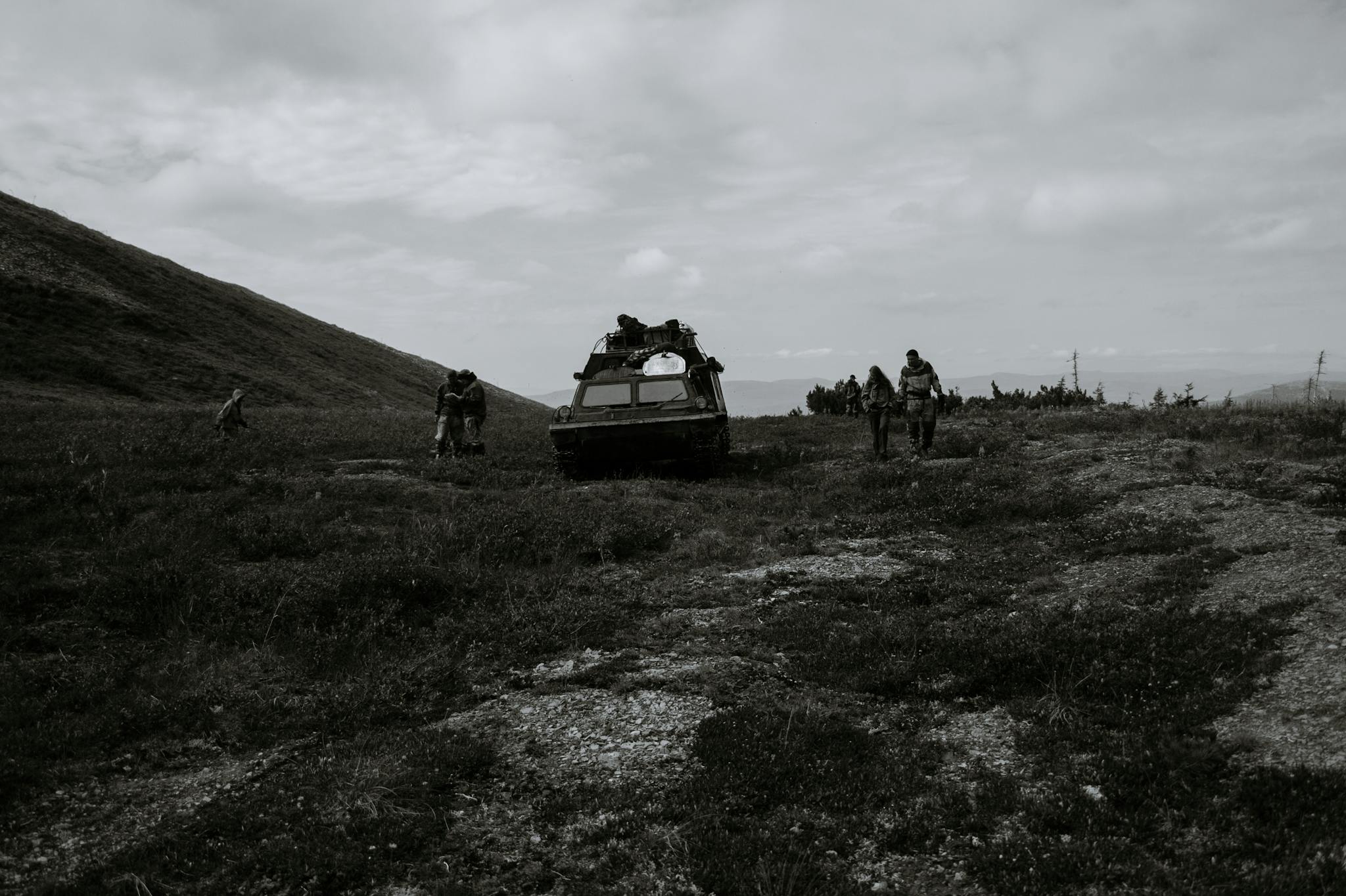 Unrecognizable soldiers near tank during military training